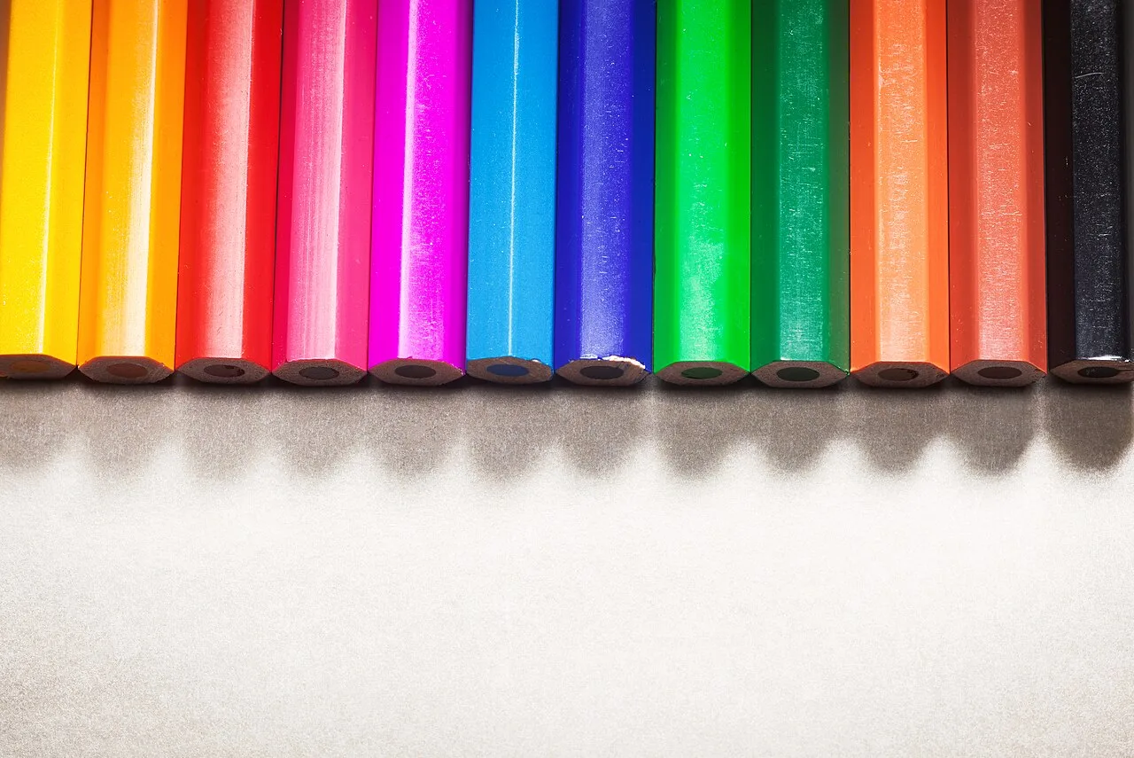 A row of brightly colored pencils