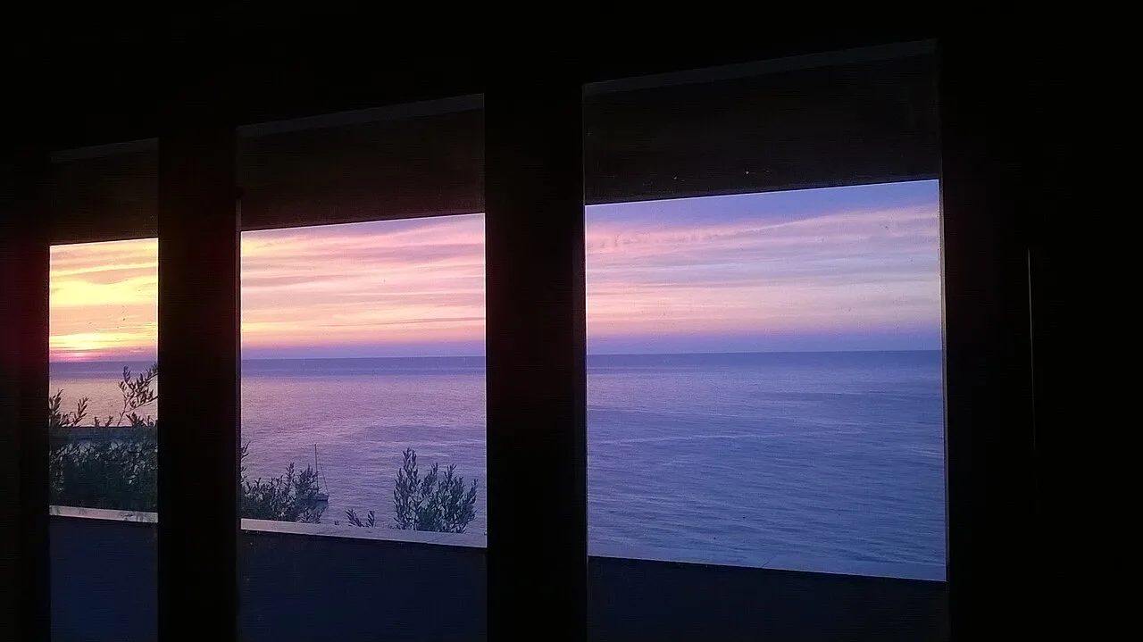An evening sky seen through a window